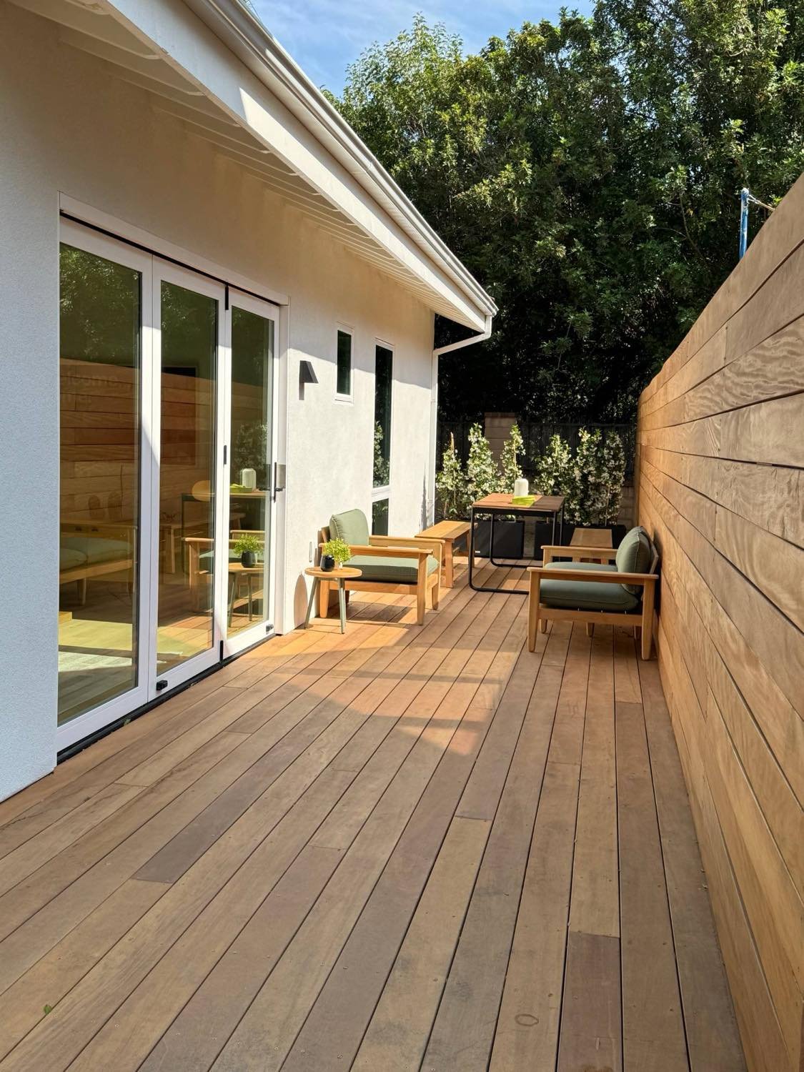 Ipe wood deck and folding doors of a detached ADU