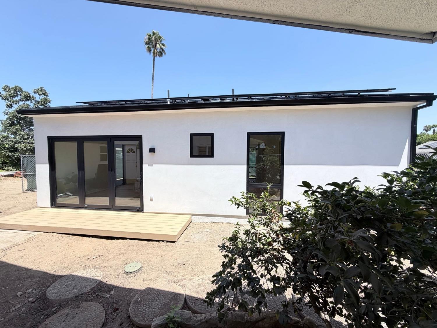 Modern white-stucco detached ADU exterior
